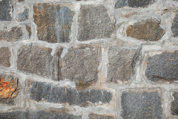 stone wall with rugged texture symbolizing strength, stability, and resilience. Its timeless beauty evokes a sense of grounding and endurance