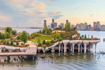 Cityscape of downtown Manhattan skyline with the Little Island Public Park in New York City at sunrise