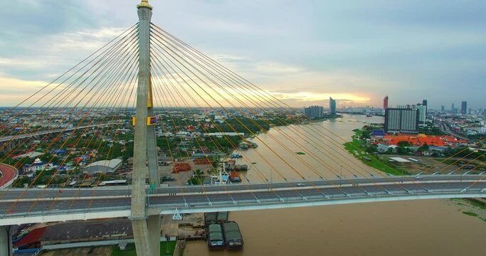 Aerial View of Bangkok and the Bhumibol Bridge inter-city expressway .Across the Chao Phraya River and ring road systems on the outer edge of Bangkok Metropolitan..beautiful King Bhumibol suspension b