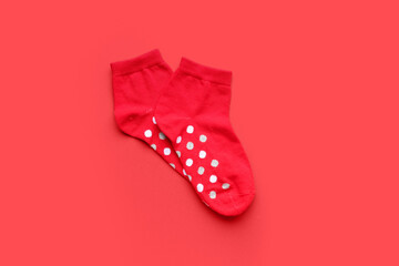 Pair of cotton socks on red background