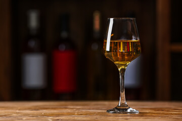 Glass of exquisite wine on table