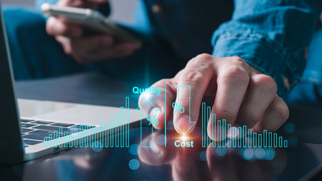 A businessman analyzes company growth on a laptop and tablet. Future cost reduction and business growth arrow graph. development for goal-achieving knowledge about finances for long-term investments.