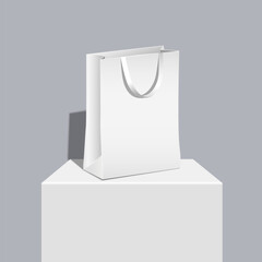 White shopping paper bag on table