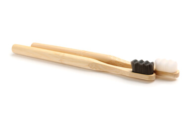 Bamboo tooth brushes on white background