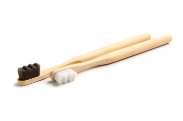 Bamboo tooth brushes on white background