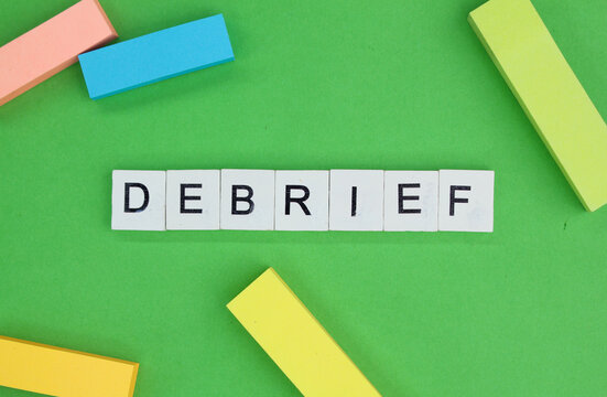letters of the alphabet with the word debrief. briefing concept