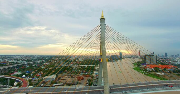 Aerial View of Bangkok and the Bhumibol Bridge inter-city expressway .Across the Chao Phraya River and ring road systems on the outer edge of Bangkok Metropolitan..beautiful King Bhumibol