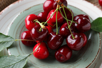Plate with sweet cherries, closeup