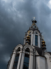 Fototapeta na wymiar A church with ominous clouds in the background.
