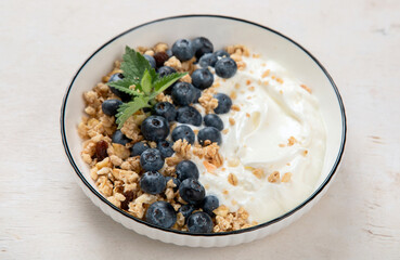 Healthy breakfast, cereal with berries and yogurt.