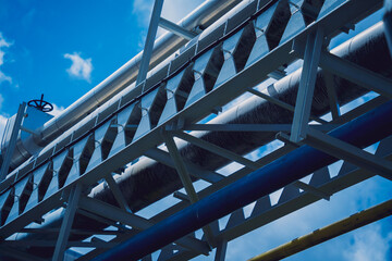 Modern steam pipeline for industrial on blue skies background.
