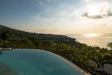 Luxury hotel infinity pool in summer