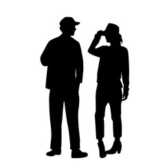 Vector silhouettes of  man and a woman, a couple standing   business people, black  color isolated on white background