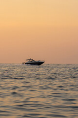 Naklejka premium Beautiful seascape with sailing yachts in summer during sunset. Travel, hobby concept
