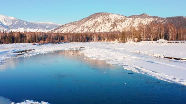 Altai mountains in winter. Katunsky Ridge and Katun River. Aerial view.
