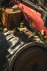 Vertical shot of an old dirty shore abandoned in a landfill