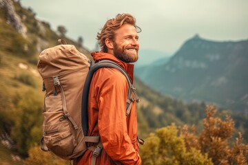 handsome smiling young man with beard backpack trekking outdoors