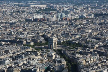 Aerial shot of Paris, France showcasing the stunning cityscape illuminated in the sunlight