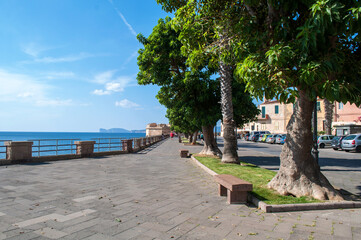 Alghero, Sardinia - October 3, 2014:Embankment on the walls with a promenade in the city on the coast