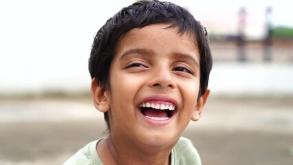 Portrait of a happy laughing child boy. Close-up portrait of him he nice-looking attractive lovely healthy glad cheerful cheery foxy ginger boy enjoying good mood.