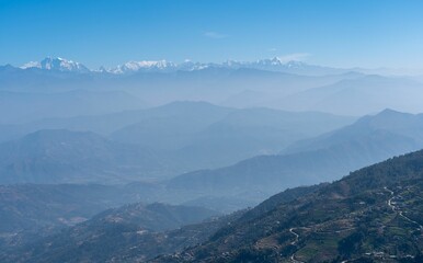 Scenic view of majestic the Himalaya Mountains   with bright blue and fluffy clouds in the sky