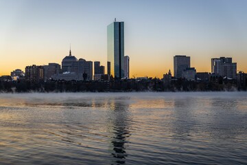 Vibrant city skyline of Boston with illuminated skyscrapers against a night sky