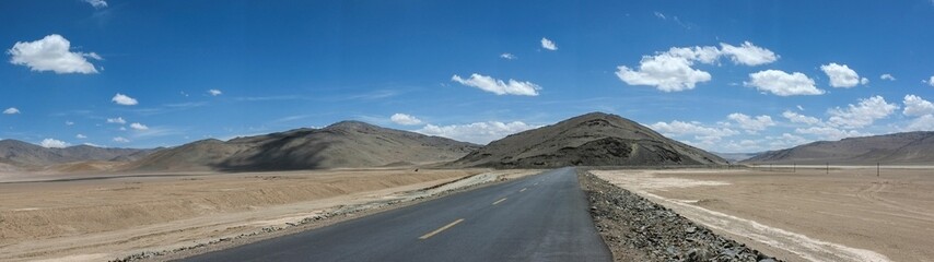 Panoramic shot of an empty road against mountains