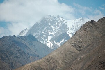 Scenic winter landscape featuring a mountainous range covered in snow