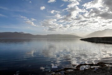 Aerial view of lake surrounded by mountains
