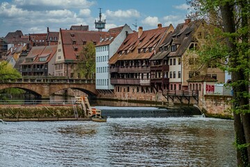 Beautiful landscape of Nuremberg, Germany, a river running amidst old-fashioned houses