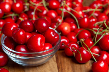 red cherries on wooden table