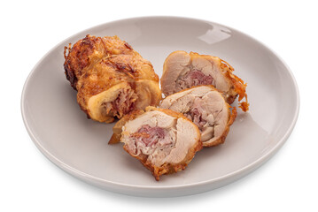 Chicken roulade. Slices of rolled roast chicken meat stuffed with bacon in white dish