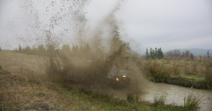 Off-road The SUV drives into a deep puddle.