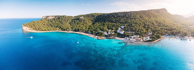 aerial paradise view, showcasing an idyllic harbor adorned with luxurious yachts and majestic...