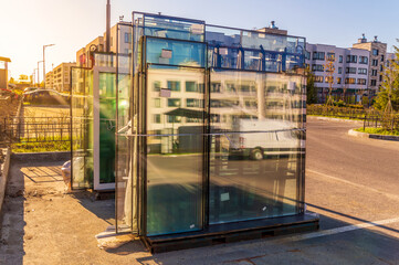 New sealed glass units at building site. Storage and preparation at the installation of windows