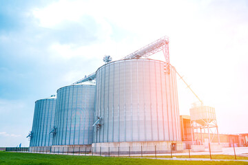 Fototapeta na wymiar Storage tanks cultivated agricultural crops processing plant
