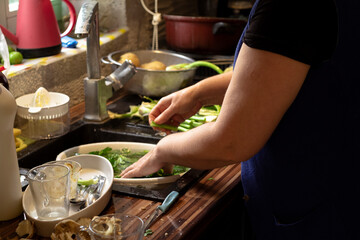 Obraz na płótnie Canvas Woman Body Part Preparing Meal In The Kitchen, Kitchen Items