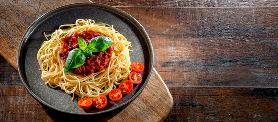 Composition with a plate of spaghetti bolognese