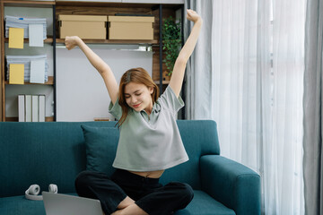 Woman is doing a stretchy posture due to sitting in the home office for too long, office syndrome concept. - obrazy, fototapety, plakaty