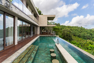 Luxury hotel infinity pool in summer