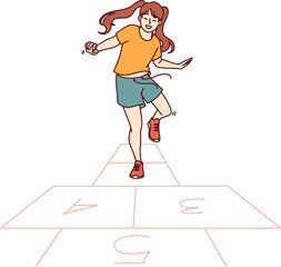 Little girl plays hopscotch jumping on cages drawn on pavement asphalt on summer sunny day