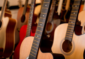 Obraz na płótnie Canvas Many rows of classical guitars in the music shop