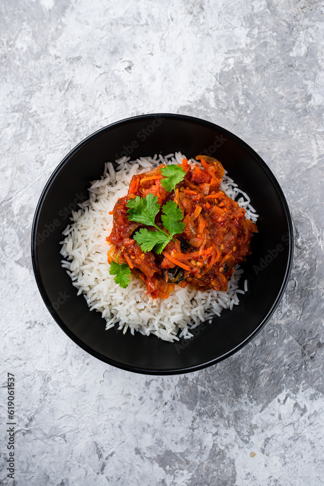 Sticker rice with stewed eggplants, sweet peppers, carrots, tomatoes, onions, sauce and parsley, fresh lunch