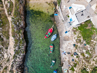 drone top down view of Cala Port'Alga, a beautiful touristic location near Polignano a mare, Bari,...