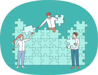 Colleagues connect jigsaw puzzles finding solution