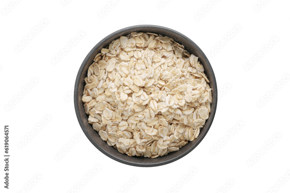 Wall mural a top view of oat flakes in a ceramic bowl on white background