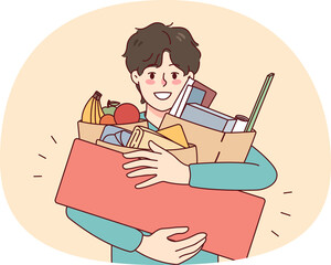 Happy man holding bags with purchases on sale