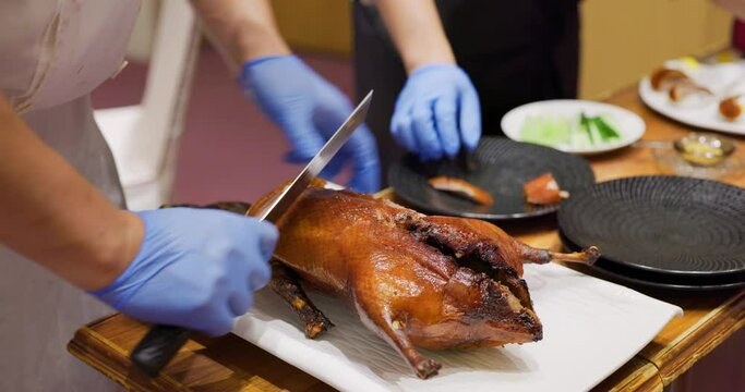 Chef prepare peking duck in restaurant for serving customer