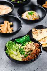 Dan Dan noodles with minced pork, Fuju asparagus marinated in rice vinegar, rice and Naan flatbread.