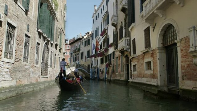 Beautiful Venetian Popular travel destination in Metropolitan City of Venice in Italy. Ancient town Venezia, Italia Gondola boats in Grand Canal.